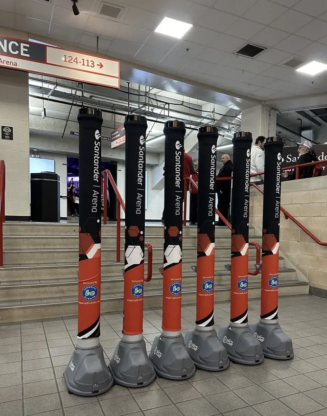 A row of OPENGATE lanes on an arena concourse