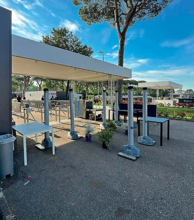 A shaded outdoor OPENGATE checkpoint at a tennis tournament in Rome