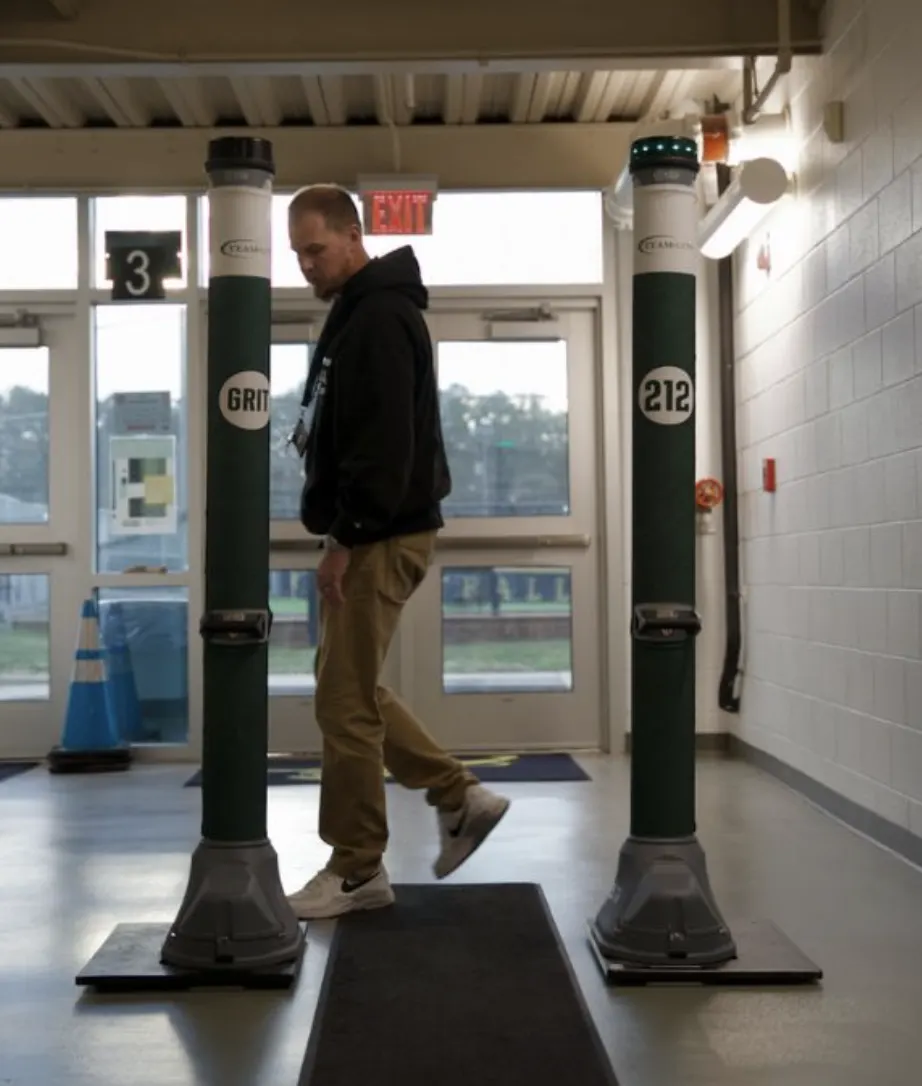 A member of staff walking through OPENGATE at a school entrance